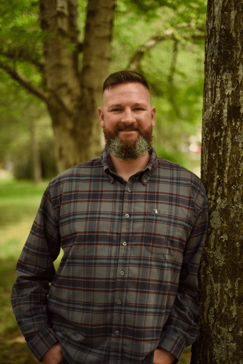 Caleb W Allen Financial Advisor TN Calebs headshot Caleb W Allen Financial Advisor TN | Picture of Caleb W Allen leaning against a tree, smiling warmly